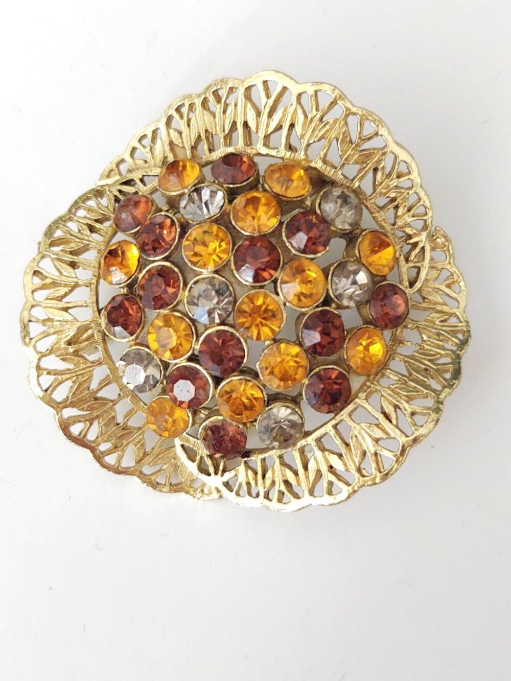 Gold and crystal brooch
